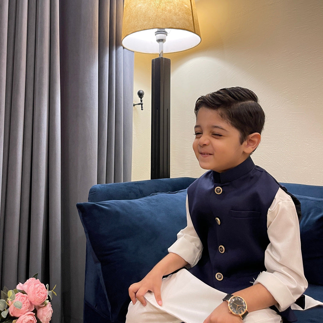 Muraqsh Ready To Wear Solids Cotton Boys Off White Kurta Trouser with Navy Blue Suiting Waistcoat MURP - Summer Collection