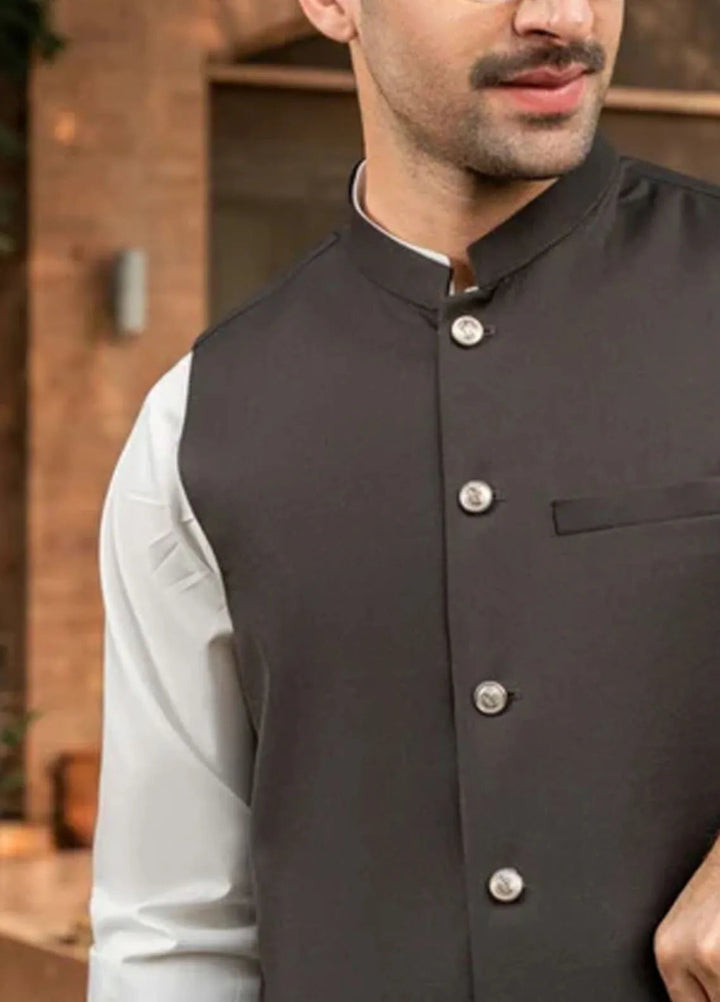 Muraqsh Off White Kameez Shalwar with Brown Suiting Waistcoat Round Cut