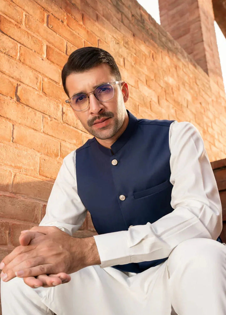 Muraqsh Off White Kameez Shalwar with Navy Blue Suiting Waistcoat Round Cut